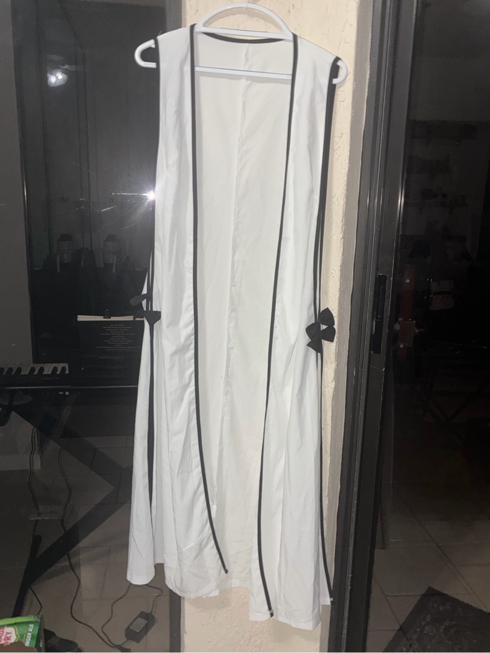 White Sleeveless Duster with Black Piping and Side Ties